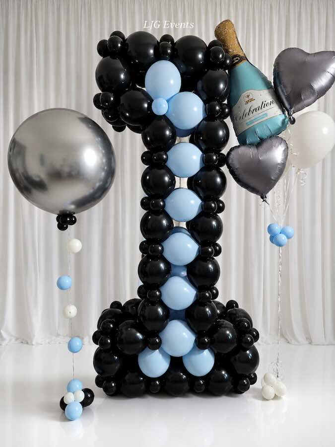 Black and blue number one balloon display