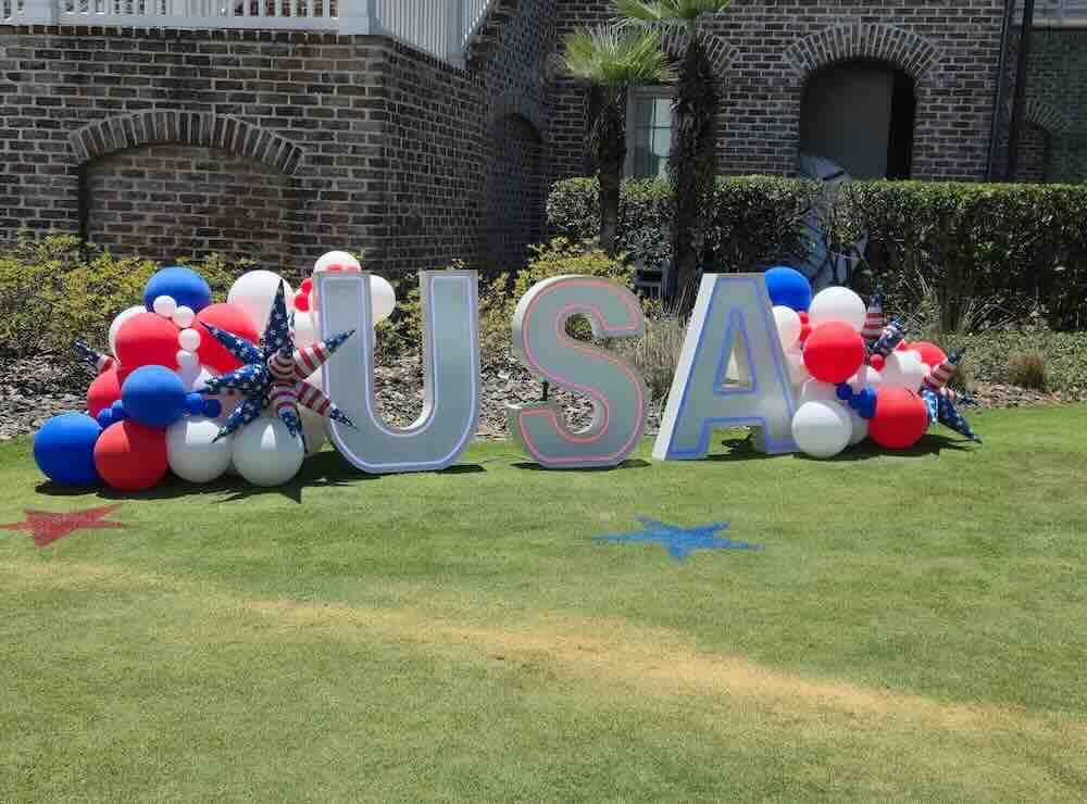 USA letters with red, white, and blue balloons