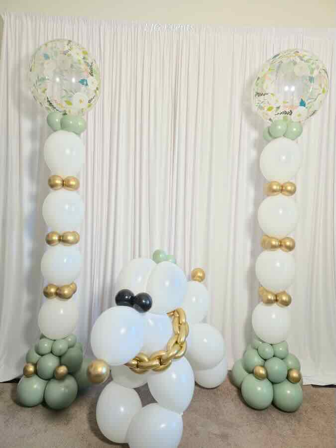 Elegant baby shower balloon columns and centerpiece display