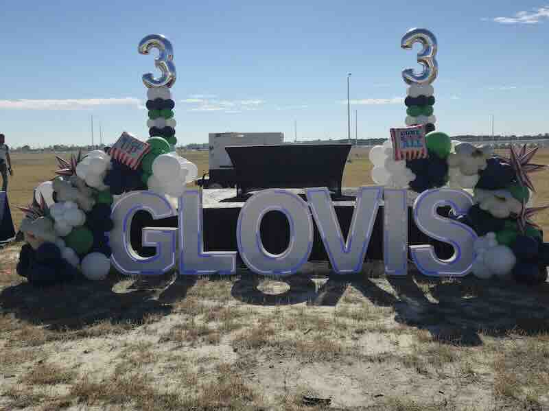 Glovis 3rd anniversary outdoor celebration setup with balloons.