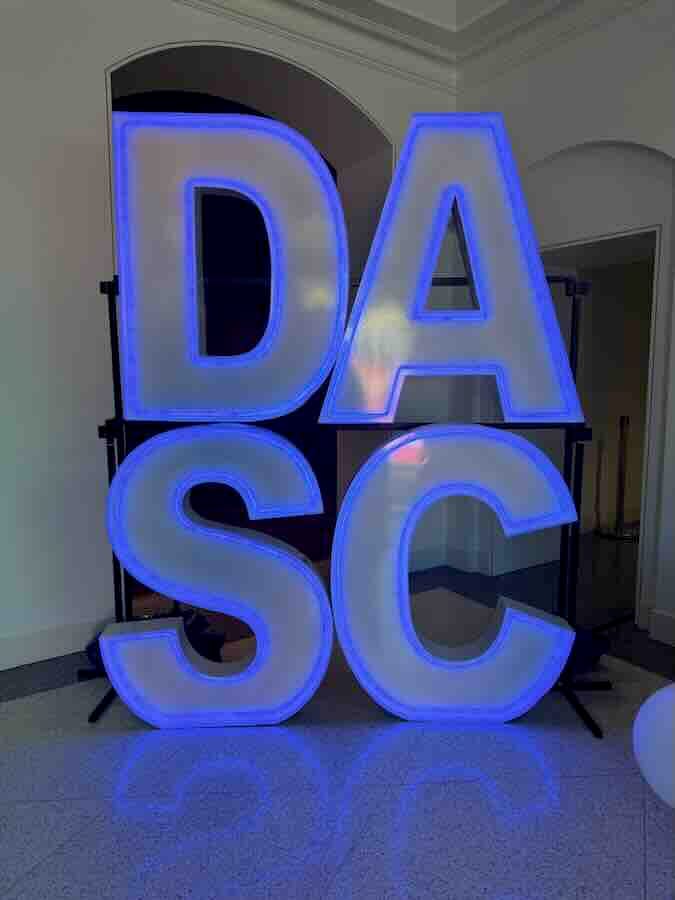 Large illuminated DASC letters with blue lighting