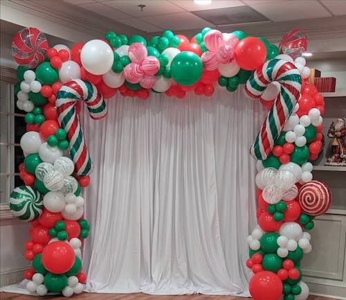Festive balloon arch with candy decorations