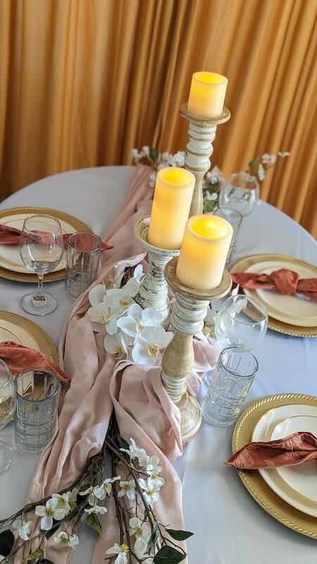 Elegant table setting with candles and flowers