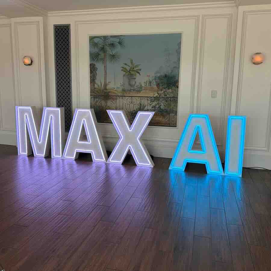 Illuminated MAX AI letters in elegant room