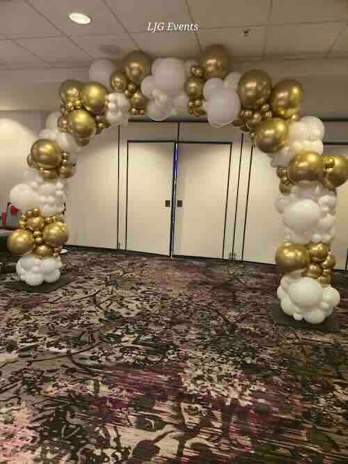 Gold and white balloon arch for events