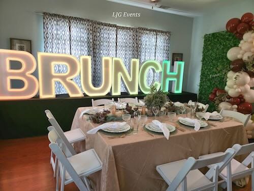 Elegant brunch table setting with bright lettering.